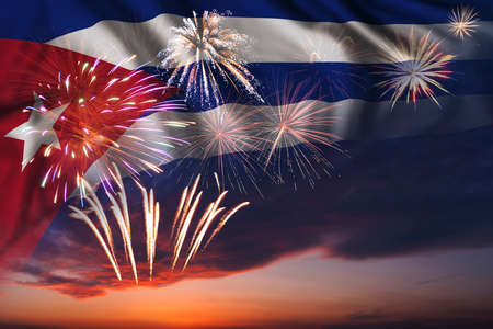 Majestic fireworks in evening sky and flag of Cuba for Independence day or National Holidayの写真素材