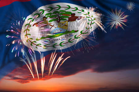 Majestic fireworks in evening sky and flag of Belize for Independence day or National Holidayの写真素材