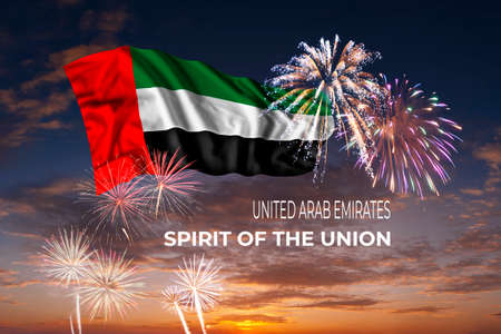Holiday sky with fireworks and flag of United Arab Emirates on Union dayの写真素材