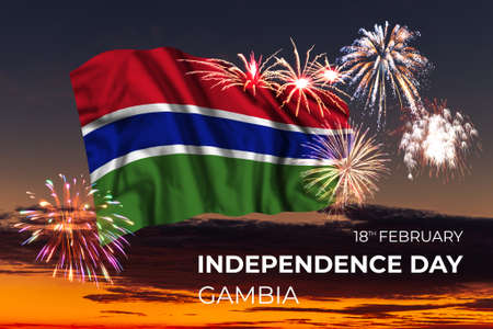 Evening sky with majestic fireworks and flag of Gambia on National holidayの写真素材