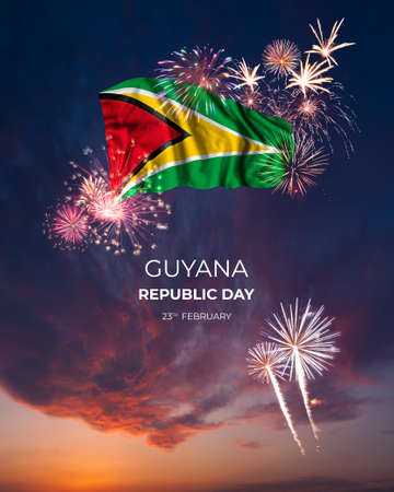 Evening sky with majestic fireworks and flag of Guyana on National holidayの写真素材