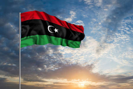 Waving National flag of Libya in beautiful skyの写真素材