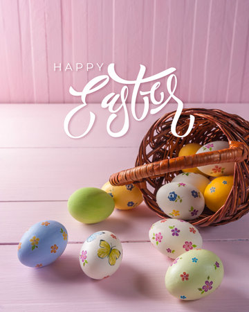 Easter painted eggs in basket and hand lettering textの写真素材