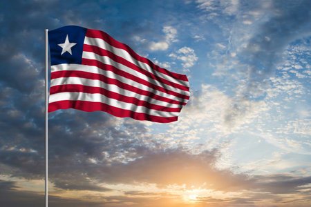 Waving National flag of Liberia in beautiful skyの写真素材