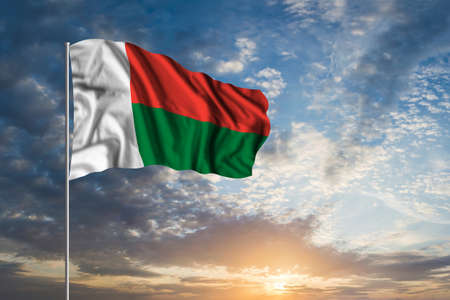 Waving National flag of Madagascar in beautiful skyの写真素材