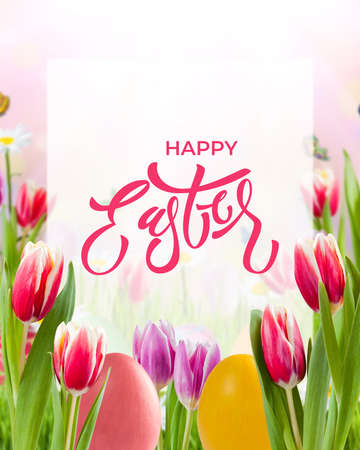 Easter holiday background with eggs and tulip flowers and lettering text on white sheetの写真素材
