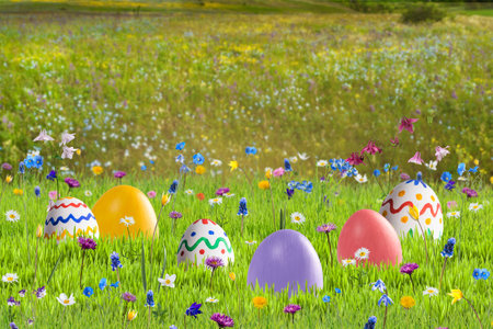Easter card with eggs and flowers on green meadow, place for your greetings textの写真素材