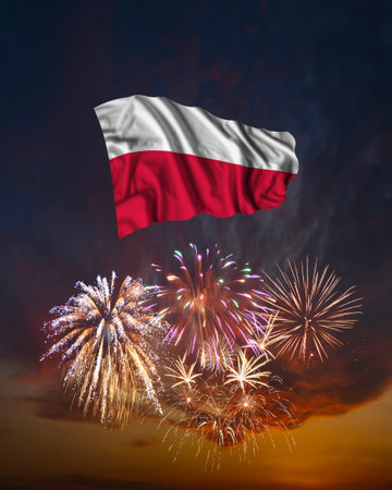 Holiday fireworks in evening sky and flag of Poland for National Independence dayの写真素材