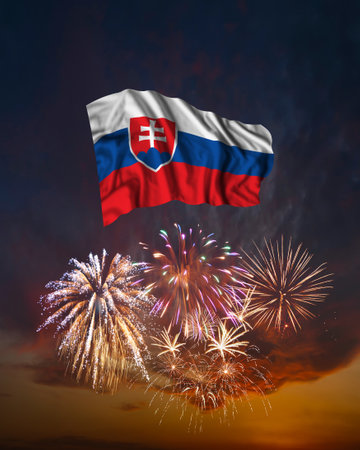 Holiday fireworks in evening sky and flag of Slovakia for National Independence dayの写真素材