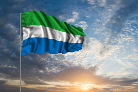 Waving National flag of Sierra Leone in beautiful skyの写真素材