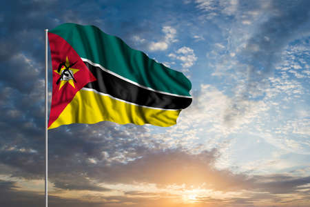 Waving National flag of Mozambique in beautiful skyの写真素材