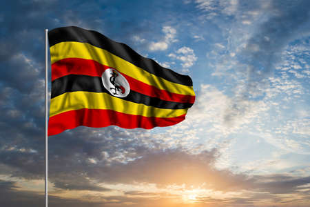 Waving National flag of Uganda in beautiful skyの写真素材