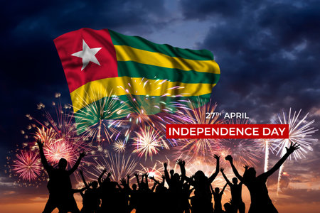 Evening sky with majestic fireworks and flag of Togo on National holidayの写真素材