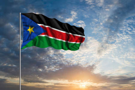 Waving National flag of South Sudan in beautiful skyの写真素材
