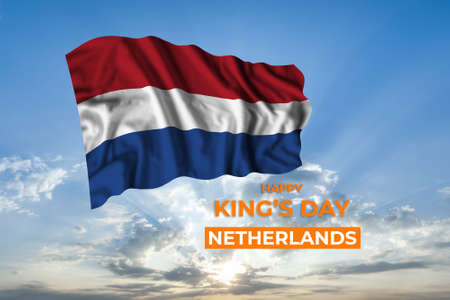 Netherlands Kings day card with flag in sunny blue sky. national holidayの写真素材