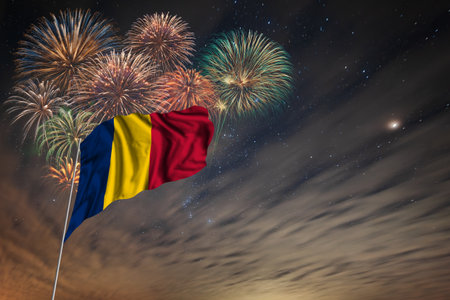 Waving National flag and holiday fireworks on night sky background with stars for independence dayの写真素材