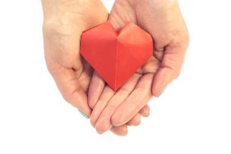 Red paper heart isolated on whiteの写真素材