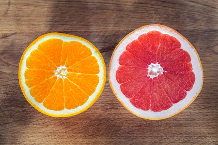 Fresh Orange and Grapefruit on Wooden Backgroundの写真素材