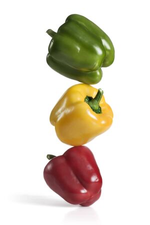 Three fresh bell peppers on whiteの写真素材
