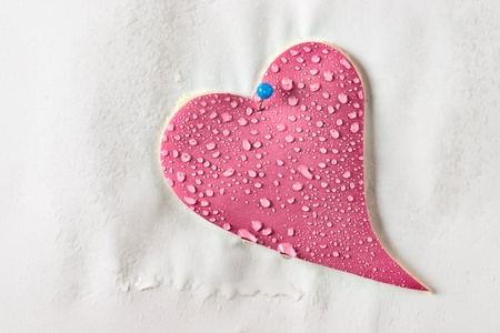 Water drops on leather pink heartの写真素材