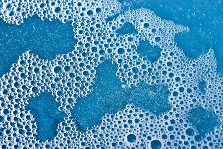 Soap foam background in blue