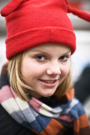 Portrait of girl wearing red knit hatの写真素材