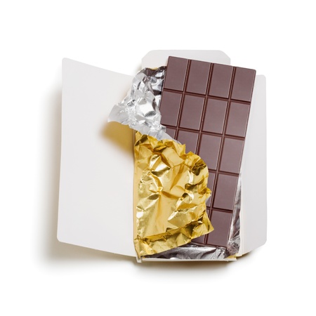 Chocolate bar wrapped in foil with open cardboard on white background, clipping path includedの写真素材