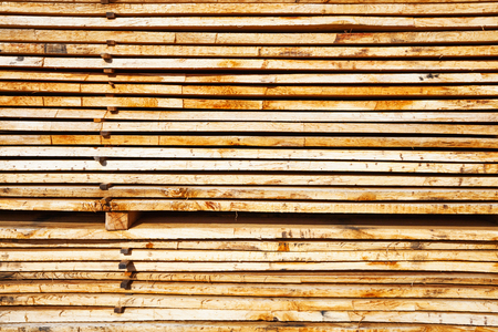 Stack of wooden boards at the lumber yardの写真素材