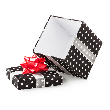 Open black gift box with white dots and red ribbon bow. Holiday present. Object isolated on white background. Clipping pathの写真素材