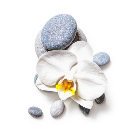Spa stones and white orchid flower isolated on white background clipping path included. Flat layの写真素材