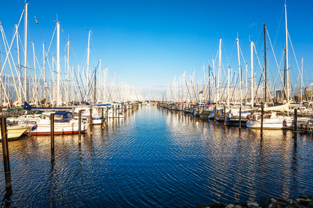 Small yachts moored in a marina. Baltic sea coast, Germany, Heiligenhafen, travel destinationの写真素材