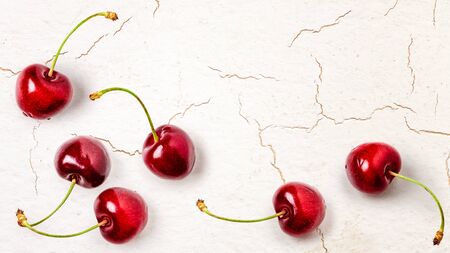 Fresh red cherry fruit composition on vintage background. Healthy eating and dieting concept. Summer...