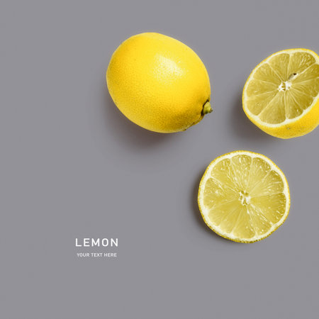 Yellow lemon fruits composition on gray background. Trendy colors 2021. Healthy eating and food concept. Citrus fruits arrangement. Top view, flat lay, design elementの写真素材