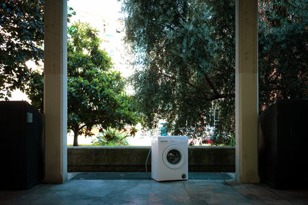 Abandoned washing machine in the street of a city