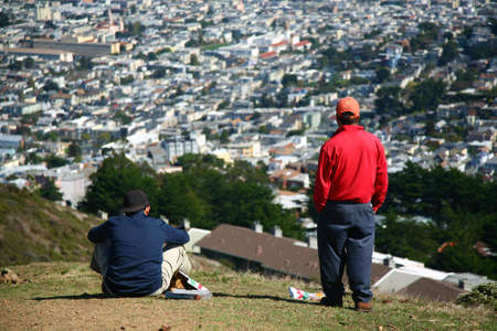 Two men watching the city from the hills of twin peacksのeditorial素材