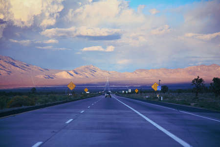 A long straight road through the desert