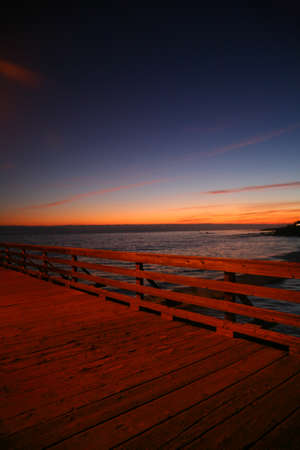 Beautiful sunset over the sea on Cayucos Pierの写真素材
