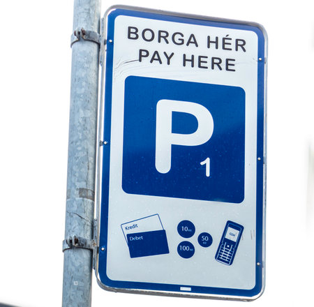 Parking sign in Reykjavik, Iceland. Shows directions for payment, with options to pay by credit and debit card, cash or phoneの写真素材