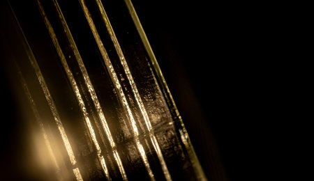 Close-up of the screw thread (neck finish) of a transparent glass jar, highlighting the parallel...