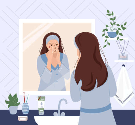 Morning routing. Young woman standing in front of mirror and cleansing or moisturizing her skin. Everyday personal care, skincare daily routine, hygienic procedure. Flat cartoon vector illustrationのイラスト素材