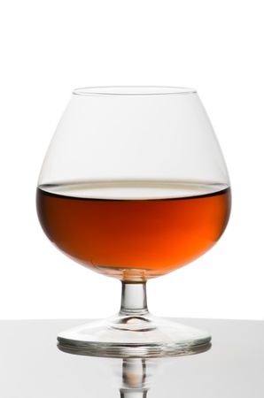 Glass of brandy isolated on white backgroundの写真素材