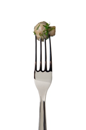 Marinated mushroom on fork isolated on white backgroundの写真素材