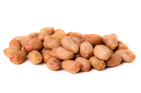 Heap of groundnuts isolated on white background