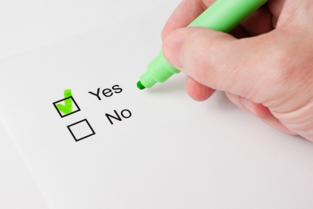 Questionnaire with choices. 'Yes' box ticked by green marker.