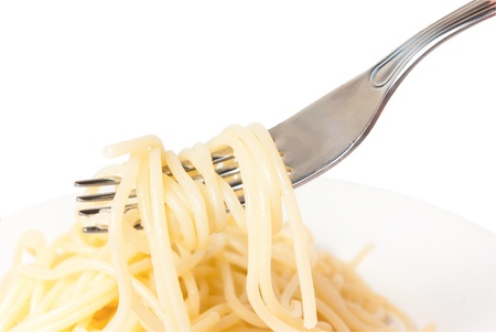 rolled on a fork spaghetti isolated on white background