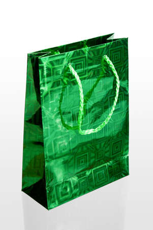 Green gift bag with rope handlesの写真素材