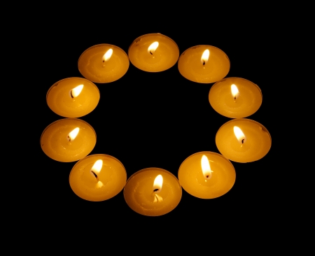 luminous ring from candle isolated on black backgroundの写真素材