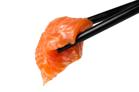 Chopsticks with sliced raw trout isolated on white backgroundの写真素材