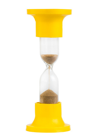 Yellow hourglass isolated on white の写真素材