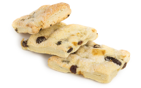 Flaky homemade biscuits with raisins isolated on white backgroundの写真素材